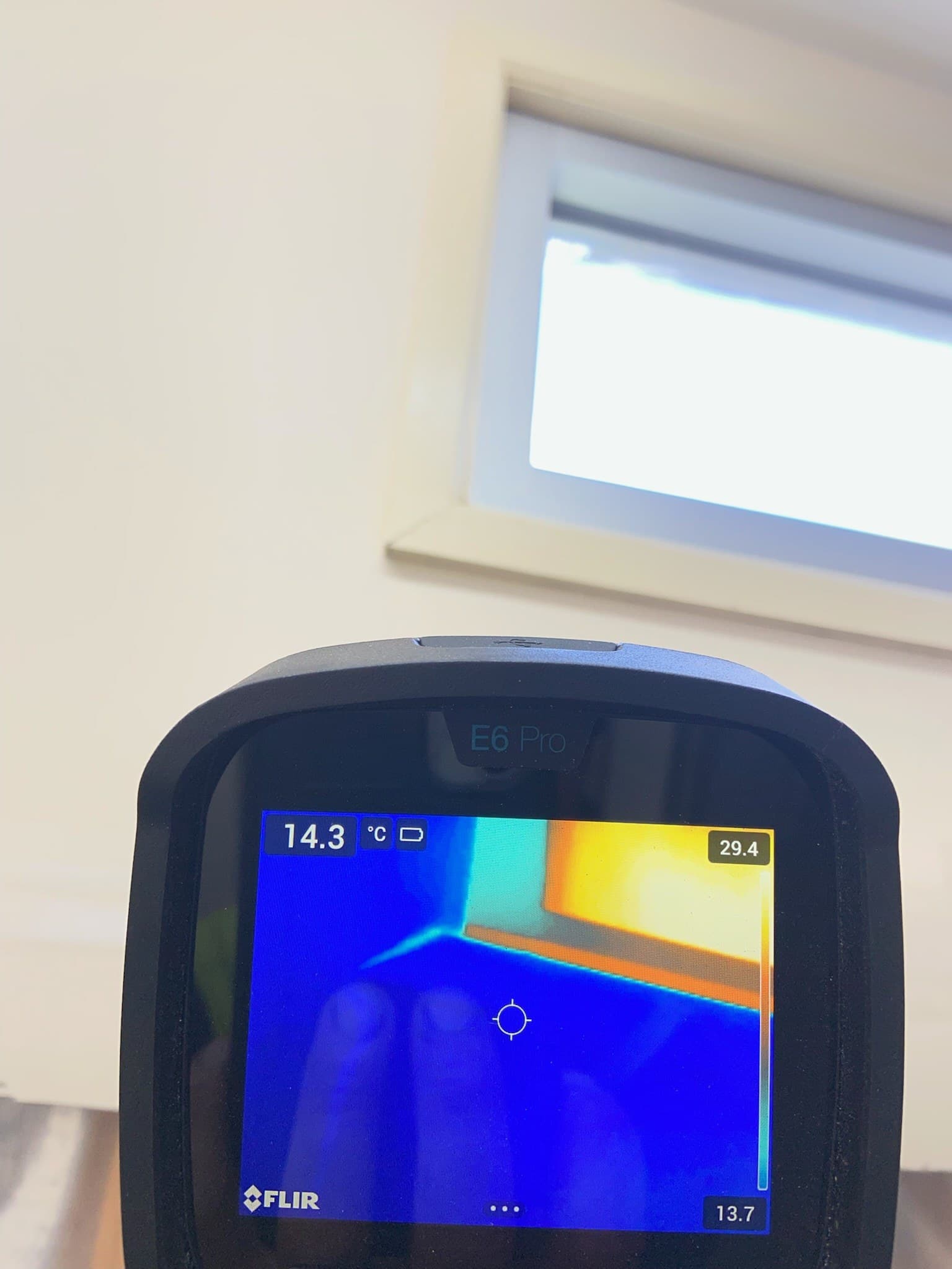 Thermal imaging camera reading a temperature variance near a window